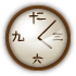 A wall clock with Japanese numerals shows approximately 11:15, featuring a brown frame and a light-colored face.